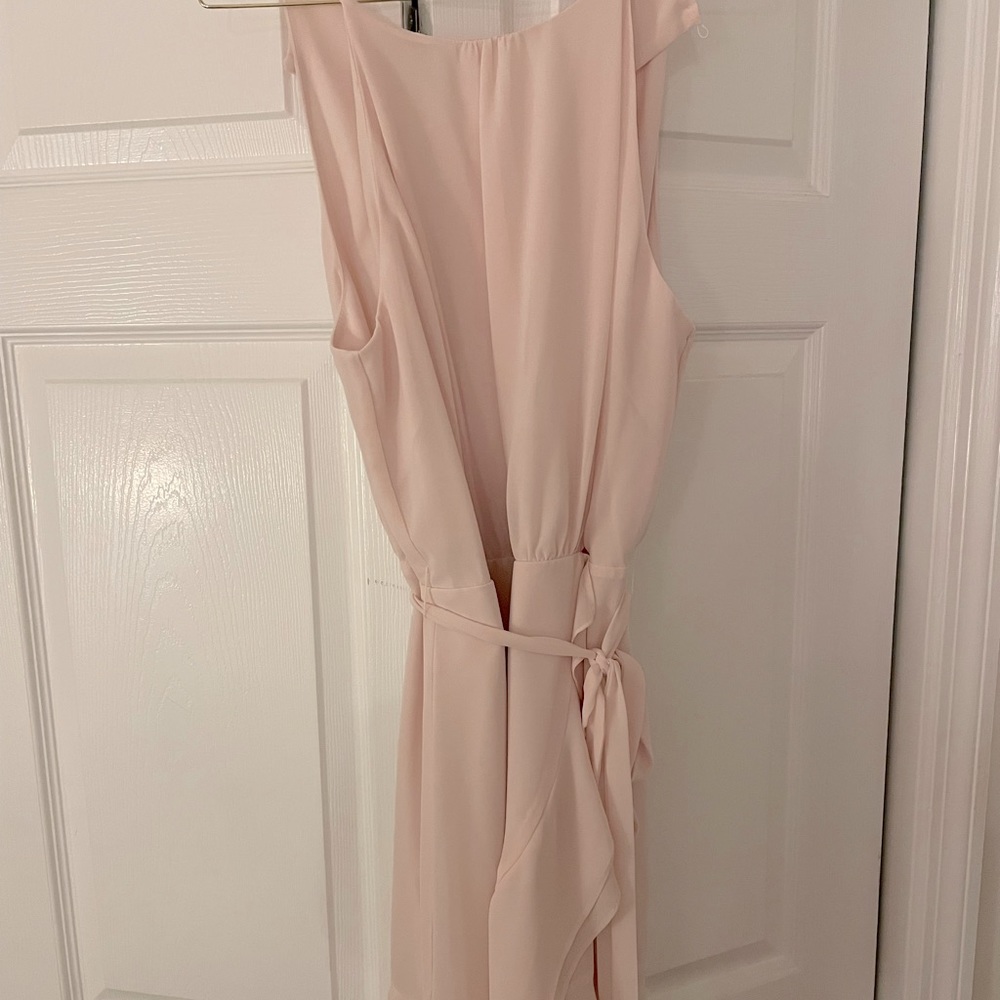 Light pink color. Ruffle sides.